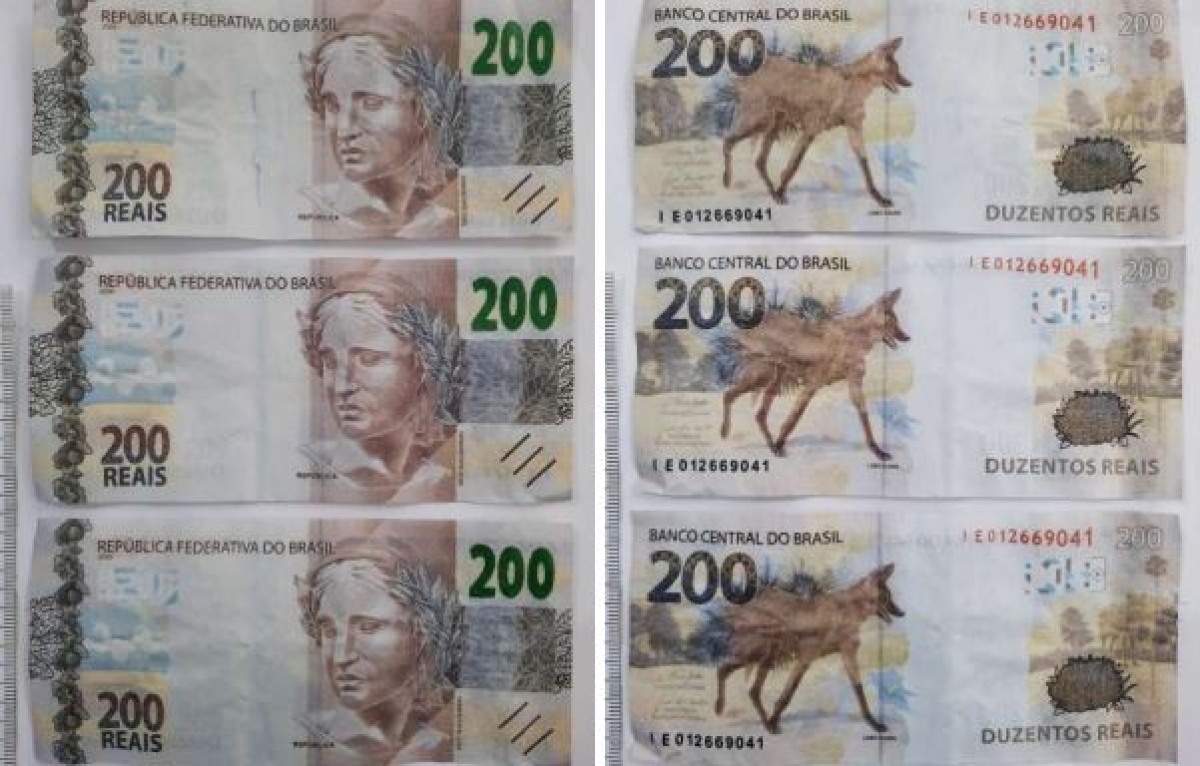 Laudo da Criminalística atesta que grupo estava com sete notas falsas de R$ 200 (Foto: SSP/SE)