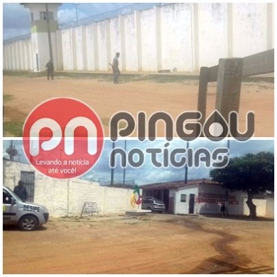 Dupla  flagrada tentando arremessar objetos para dentro do Presdio de Glria (Imagem: Pingou Notcias)